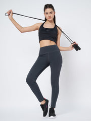 Waylene Dark Grey High-Rise Fitness Leggings with moisture-wicking fabric, shown with model holding a jump rope.