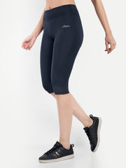 Waylene Women's Navy Blue High-Waisted Sports Capris, side view highlighting stretchy fabric and mid-calf length.