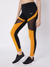 Waylene black and orange sports leggings with mesh panels, side view