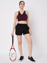 Waylene Black Polyester Shorts with Elastic Waistband and Side Pockets, styled for athletic wear.