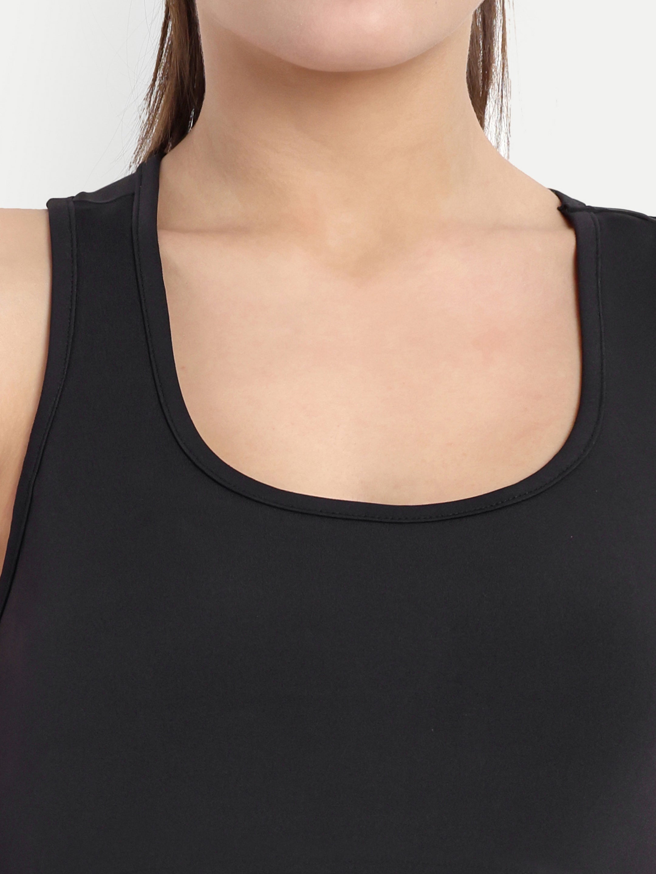 Close-up of Waylene's sports bra in black, focusing on the soft neckline and smooth fabric, suitable for both yoga and high-intensity workouts.