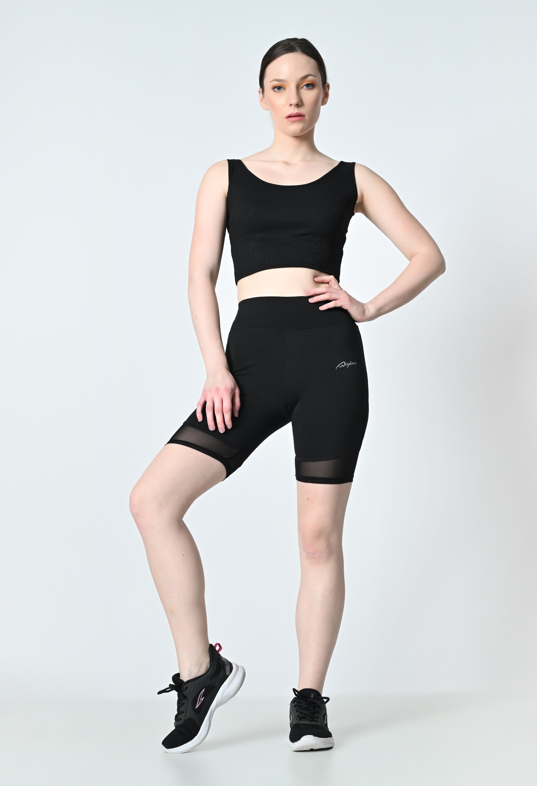 Waylene High-Rise Black Gym Shorts, styled for versatility in running and yoga.