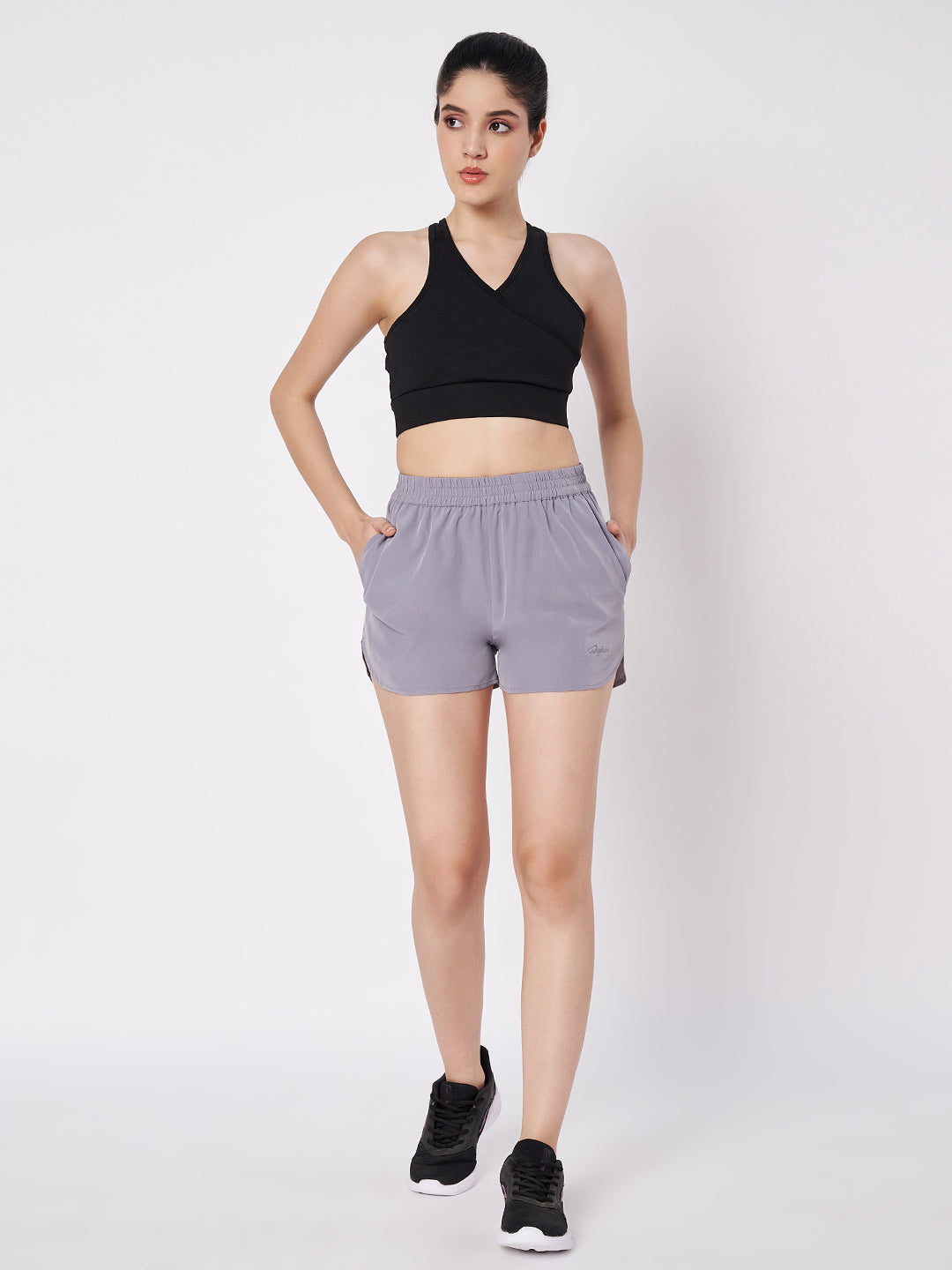Waylene Grey Polyester Shorts with Relaxed Fit and Side Pockets, front view with model in sporty pose