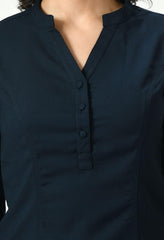 Close-up of the upper part of a dark navy blue Waylene button-up top showing detailed features like the button placket and collar.